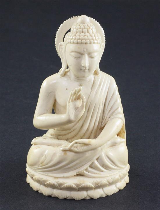 A Chinese ivory seated figure of Buddha Shakyamuni, early 20th century, 11cm